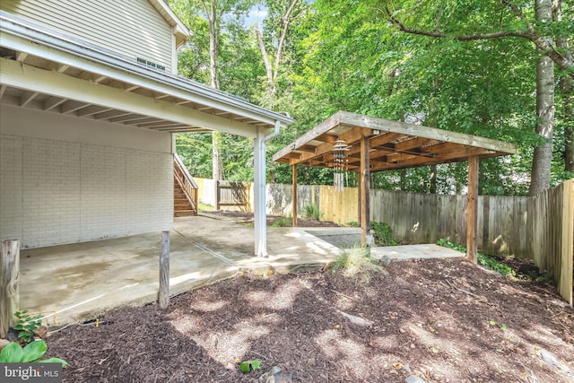 16715 Tintagel Ct, Dumfries, VA 22025 - fenced backyard with a patio area and stairs