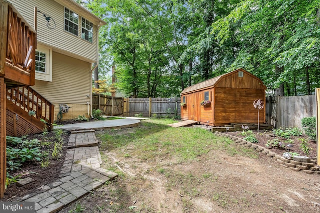 16715 Tintagel Ct, Dumfries, VA 22025 - fenced backyard featuring a storage unit and stairway
