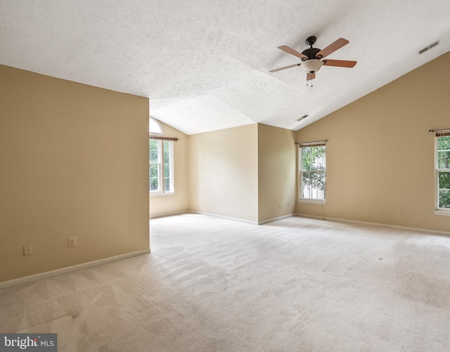 16715 Tintagel Ct, Dumfries, VA 22025 - carpeted spare room featuring lofted ceiling, ceiling fan, and a textured ceiling