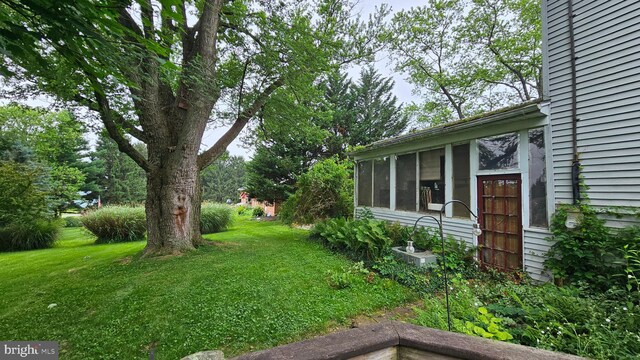 59 Singer Rd, New Freedom, PA 17349 - view of grassy yard featuring a sunroom