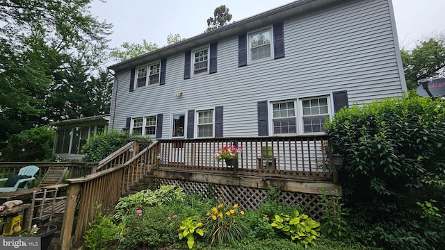 59 Singer Rd, New Freedom, PA 17349 - rear view of house with a wooden deck and a sunroom