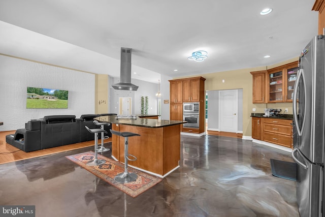 13716 Molly Berry Rd, Brandywine, MD 20613 - kitchen featuring stainless steel appliances, exhaust hood, dark countertops, open floor plan, and brown cabinetry