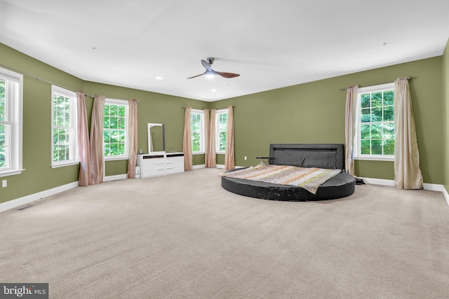 13716 Molly Berry Rd, Brandywine, MD 20613 - carpeted bedroom featuring multiple windows, ceiling fan, and recessed lighting