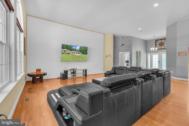 13716 Molly Berry Rd, Brandywine, MD 20613 - living room with a chandelier, light wood-style floors, recessed lighting, and an accent wall