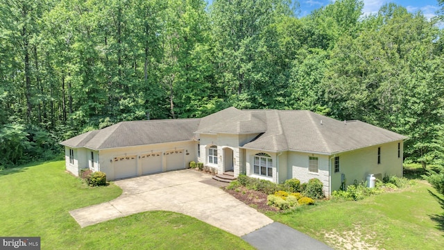 13716 Molly Berry Rd, Brandywine, MD 20613 - view of front facade with a garage, a front lawn, concrete driveway, stucco siding, and roof with shingles