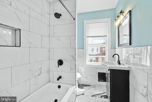 2929 N W St, Wilmington, DE 19802 - bathroom with vanity, washtub / shower combination, marble finish flooring, wainscoting, and tile walls
