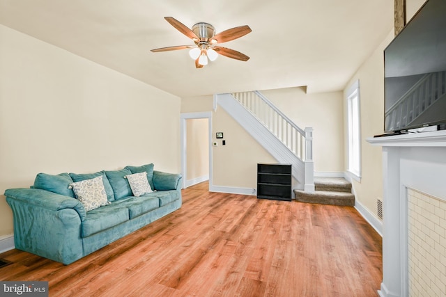 2929 N W St, Wilmington, DE 19802 - living area featuring stairs, a ceiling fan, and wood finished floors
