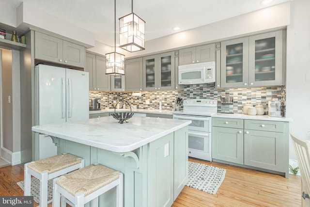 151 N Union St Unit 6, Lambertville, NJ 08530 - kitchen featuring white appliances, light wood finished floors, backsplash, decorative light fixtures, and recessed lighting