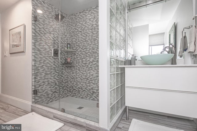 151 N Union St Unit 6, Lambertville, NJ 08530 - bathroom with vanity, a stall shower, and wood finished floors