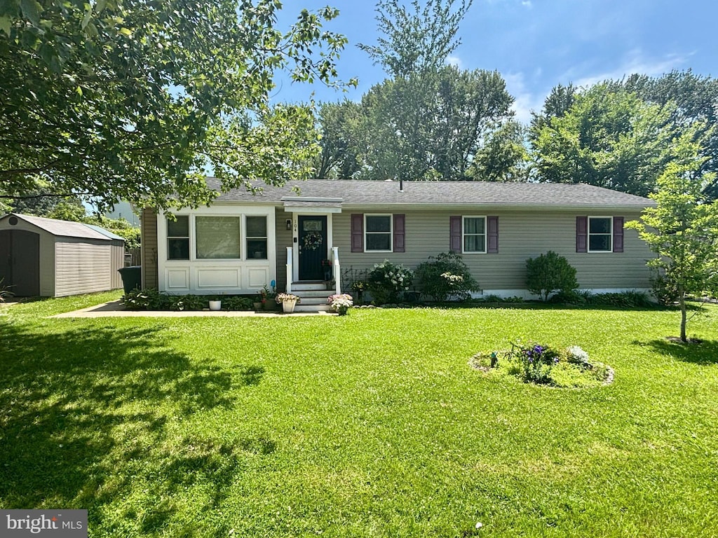 104 Thompson Ave, Queenstown, MD 21658 - ranch-style home with a shed and a front lawn