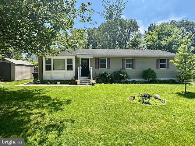 104 Thompson Ave, Queenstown, MD 21658 - ranch-style home with a shed and a front lawn