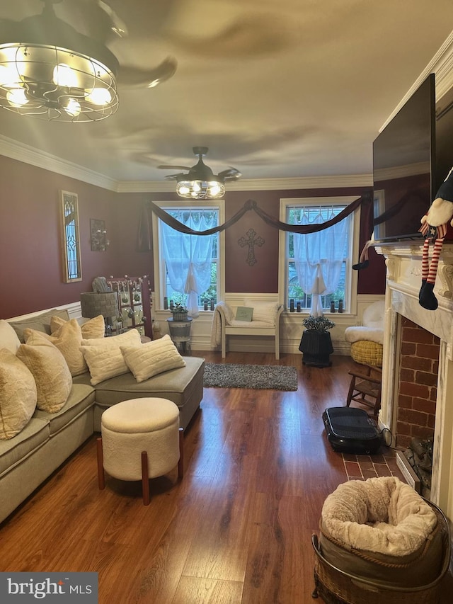 33 Aspen Ct, Bordentown, NJ 08505 - living room featuring a fireplace with flush hearth, wood finished floors, ornamental molding, a chandelier, and a ceiling fan