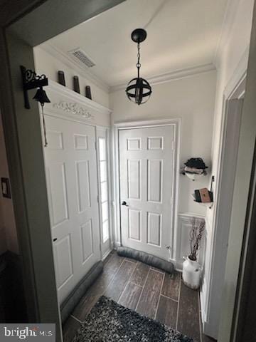 33 Aspen Ct, Bordentown, NJ 08505 - foyer featuring crown molding, dark wood-style flooring, and a chandelier