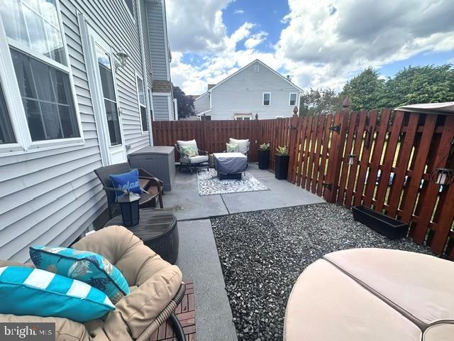 33 Aspen Ct, Bordentown, NJ 08505 - fenced backyard with an outdoor hangout area and a patio area