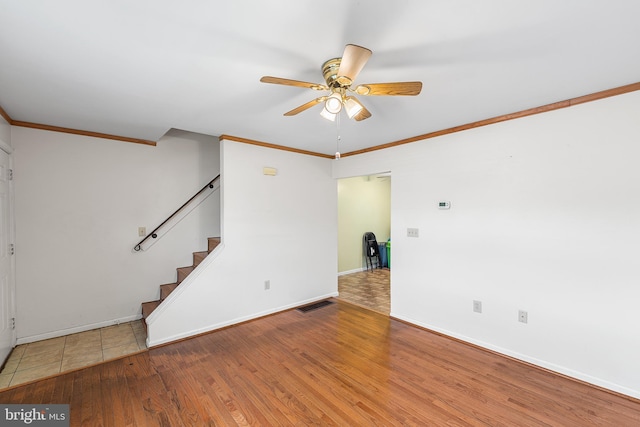 166 Center St Unit 166, Hanover, PA 17331 - unfurnished living room featuring a ceiling fan, wood finished floors, stairs, and ornamental molding