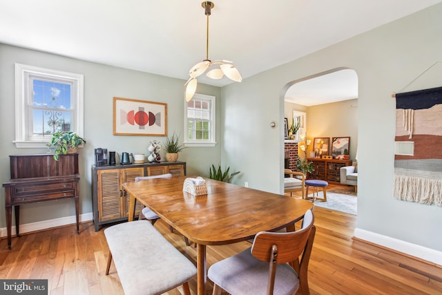 3909 17th St NE, Washington, DC 20018 - dining room with arched walkways and light wood-style flooring