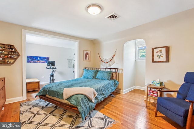 3909 17th St NE, Washington, DC 20018 - bedroom featuring wood finished floors and arched walkways