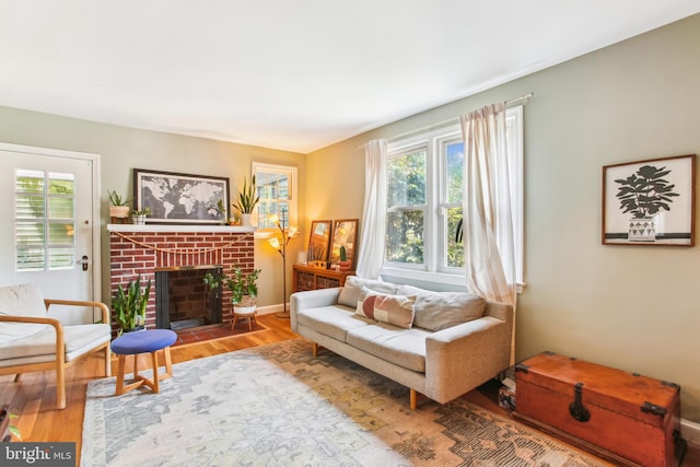 3909 17th St NE, Washington, DC 20018 - living room with wood finished floors and a brick fireplace