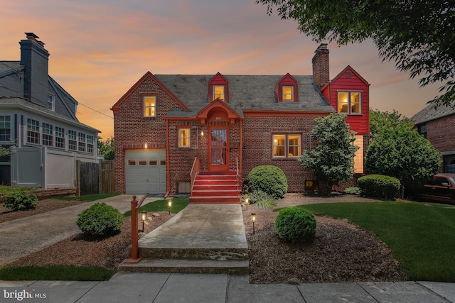 3909 17th St NE, Washington, DC 20018 - view of front facade with brick siding, a garage, concrete driveway, and a chimney
