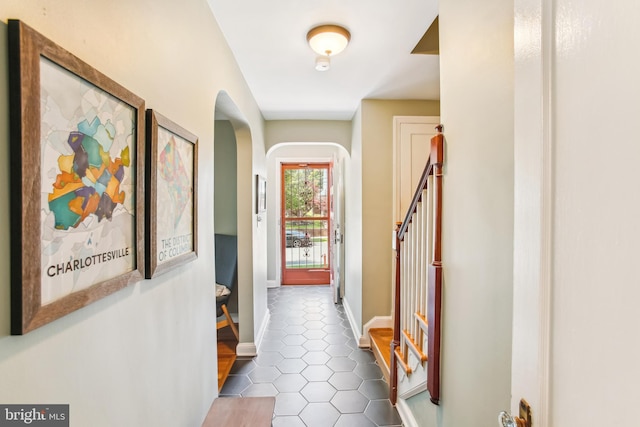 3909 17th St NE, Washington, DC 20018 - hall featuring arched walkways and dark tile patterned floors