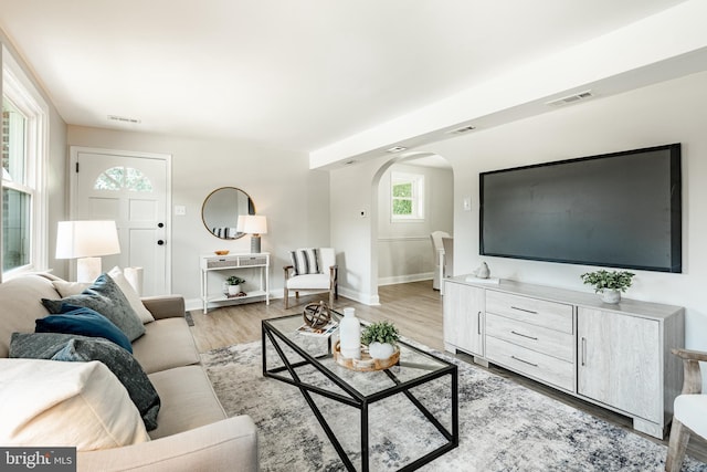 147 Meadowbrook Ave, Upper Darby, PA 19082 - living area featuring arched walkways and light wood-style flooring