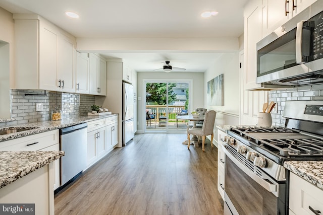 147 Meadowbrook Ave, Upper Darby, PA 19082 - kitchen featuring appliances with stainless steel finishes, light wood-type flooring, ceiling fan, white cabinetry, and recessed lighting