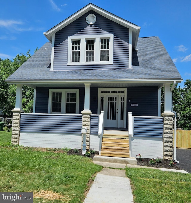 2900 Westfield Ave, Baltimore, MD 21214 - view of front facade with covered porch, a shingled roof, and a front lawn