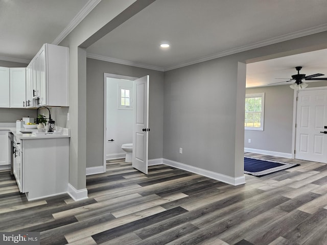 2900 Westfield Ave, Baltimore, MD 21214 - kitchen with light countertops, wood finished floors, white cabinetry, recessed lighting, and ornamental molding