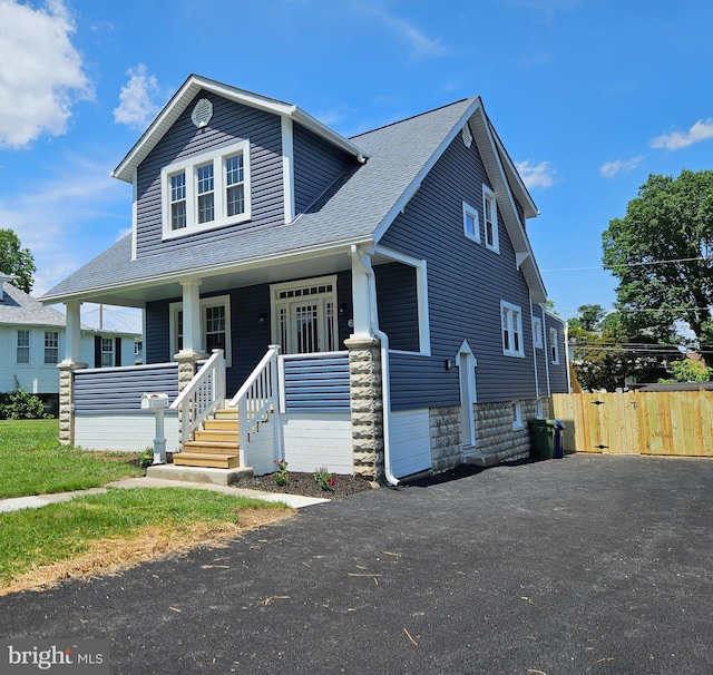 2900 Westfield Ave, Baltimore, MD 21214 - view of front of property with a shingled roof and a porch