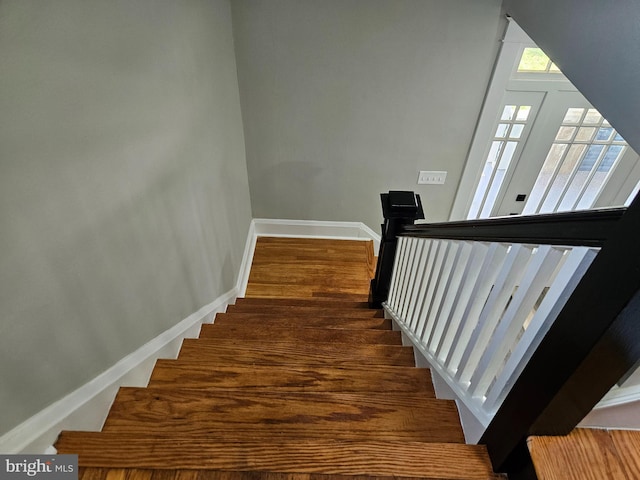 2900 Westfield Ave, Baltimore, MD 21214 - staircase featuring baseboards and wood finished floors