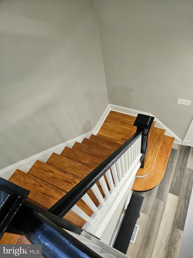 2900 Westfield Ave, Baltimore, MD 21214 - stairs featuring wood finished floors and baseboards