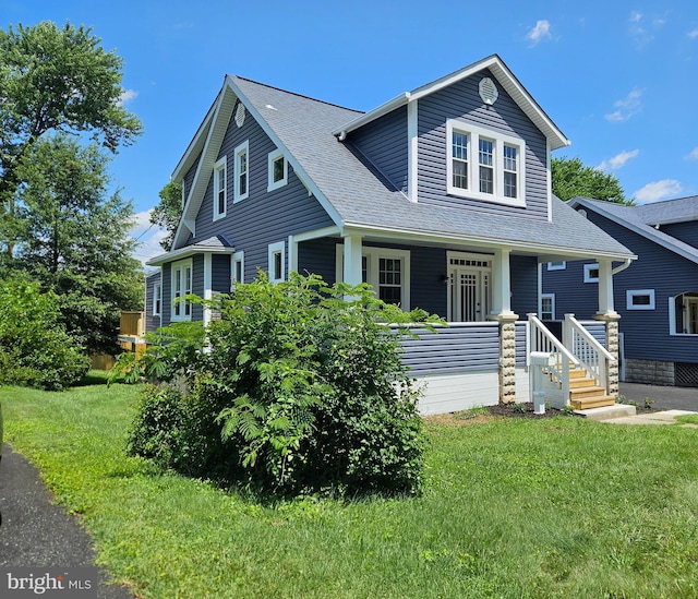 2900 Westfield Ave, Baltimore, MD 21214 - view of front of home featuring roof with shingles, a front lawn, and covered porch