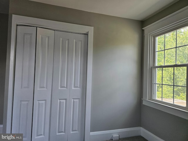 2900 Westfield Ave, Baltimore, MD 21214 - unfurnished bedroom featuring multiple windows and a closet