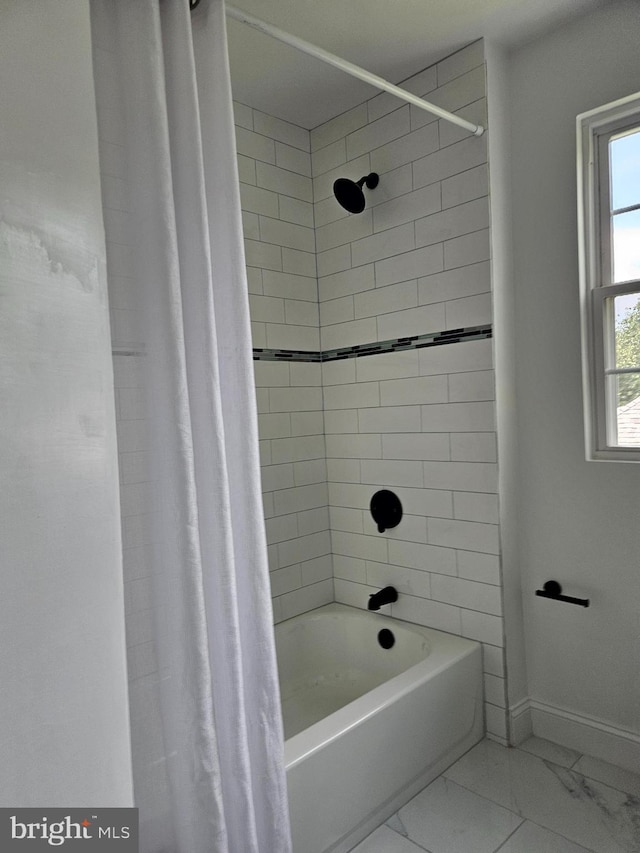 2900 Westfield Ave, Baltimore, MD 21214 - bathroom with shower / bath combo with shower curtain and marble finish floors