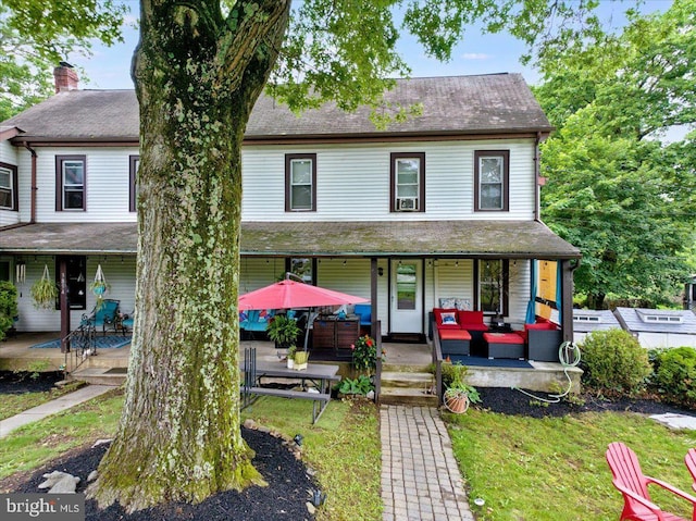 3854-3856 Schuylkill Rd, Spring City, PA 19475 - view of front of home with an outdoor hangout area, a front yard, a patio, and a shingled roof
