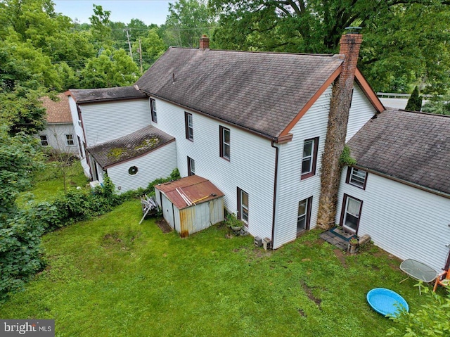 3854-3856 Schuylkill Rd, Spring City, PA 19475 - back of property with a chimney, a shingled roof, and a lawn