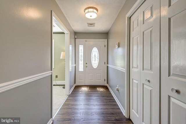 121 Pine Valley Dr, Middletown, DE 19709 - doorway to outside with dark wood-style flooring and a textured ceiling