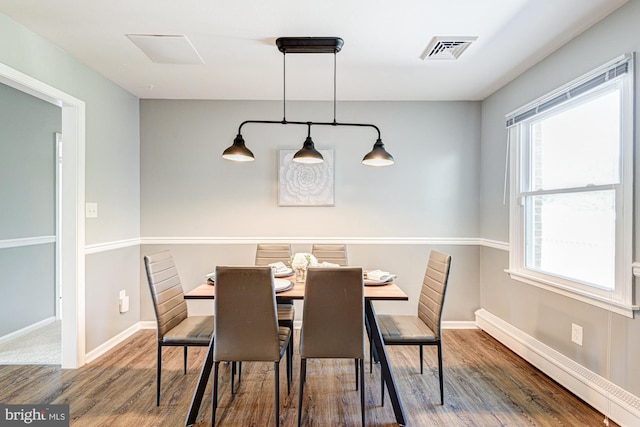 121 Pine Valley Dr, Middletown, DE 19709 - dining space featuring wood finished floors and a baseboard heating unit