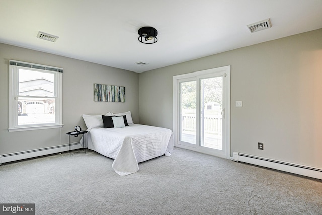 121 Pine Valley Dr, Middletown, DE 19709 - carpeted bedroom featuring baseboard heating and access to exterior