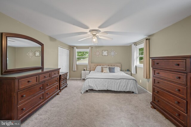 3007 Concord Dr, Cinnaminson, NJ 08077 - bedroom with light carpet, a ceiling fan, and a closet