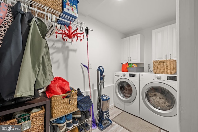 3007 Concord Dr, Cinnaminson, NJ 08077 - laundry area featuring cabinet space, washer and dryer, and light wood finished floors