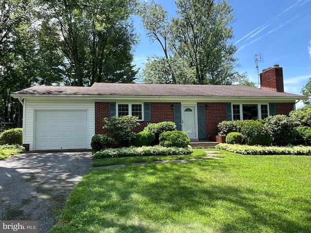 6430 Amherst Ave, Columbia, MD 21046 - ranch-style house with a chimney, an attached garage, driveway, brick siding, and a front lawn