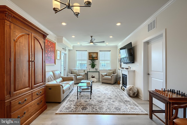 401 Bold Ruler Ct Unit 403, Havre De Grace, MD 21078 - living area featuring ornamental molding, recessed lighting, a chandelier, light wood-style floors, and a glass covered fireplace