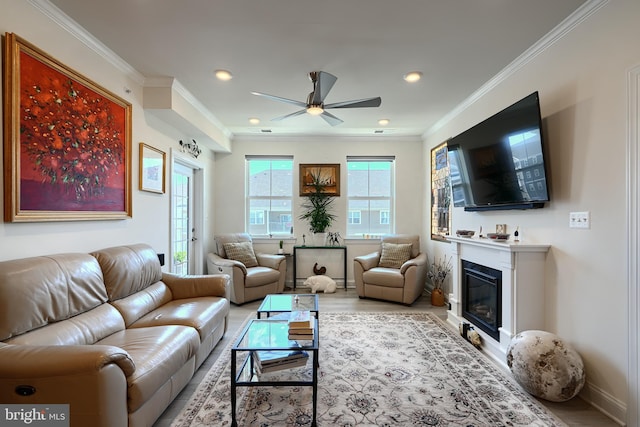 401 Bold Ruler Ct Unit 403, Havre De Grace, MD 21078 - living area with a ceiling fan, wood finished floors, crown molding, a glass covered fireplace, and recessed lighting