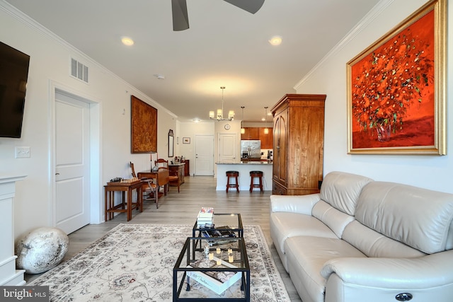 401 Bold Ruler Ct Unit 403, Havre De Grace, MD 21078 - living room featuring a ceiling fan, crown molding, light wood-type flooring, a chandelier, and recessed lighting