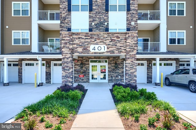401 Bold Ruler Ct Unit 403, Havre De Grace, MD 21078 - view of building exterior featuring a garage and driveway