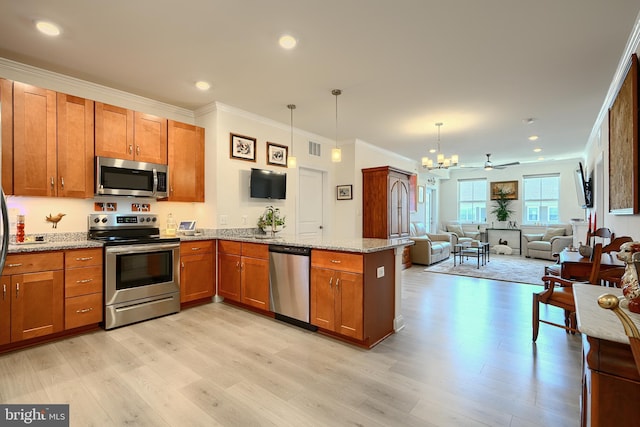 401 Bold Ruler Ct Unit 403, Havre De Grace, MD 21078 - kitchen with appliances with stainless steel finishes, brown cabinetry, a peninsula, light wood finished floors, and crown molding