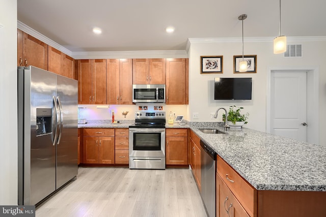 401 Bold Ruler Ct Unit 403, Havre De Grace, MD 21078 - kitchen with appliances with stainless steel finishes, brown cabinets, a peninsula, light wood finished floors, and ornamental molding
