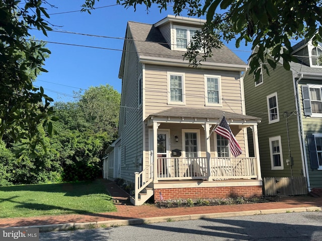 206 S Water St, Chestertown, MD 21620 - traditional style home featuring covered porch, roof with shingles, and a front yard