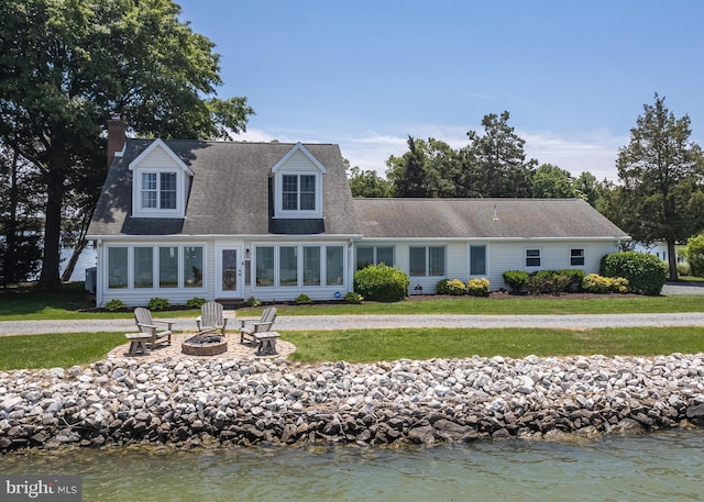 1045 Back Bay Beach Rd, West River, MD 20778 - rear view of property featuring a fire pit, a yard, a chimney, and roof with shingles